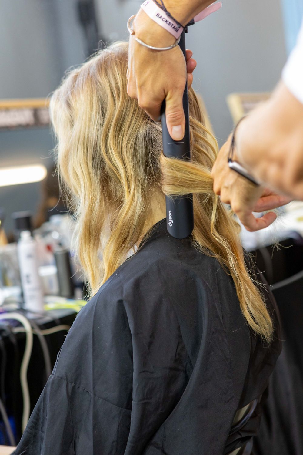 The Dyson Corrale straightener being used at Milan Fashion Week.